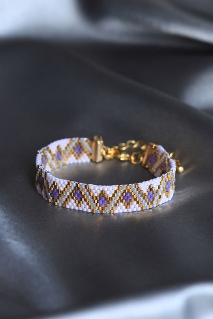 Purple beaded bracelet using 24K gold plated beads