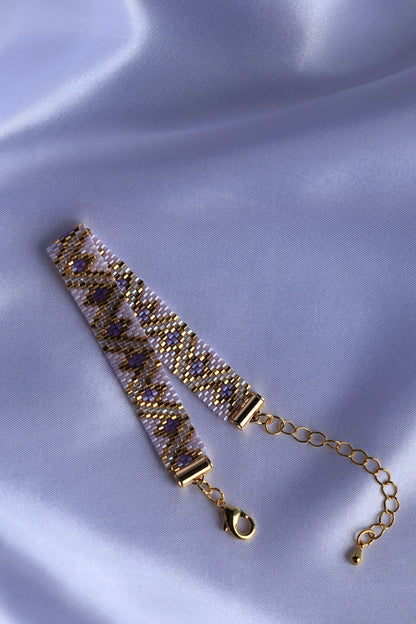 Purple beaded bracelet using 24K gold plated beads